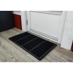 Drmtte af Sort Gummi med brste, der effektivt fanger snavset under skoene. Fs i flere strrelser